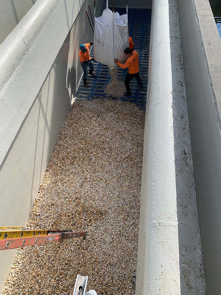 A team working in a narrow hall.
